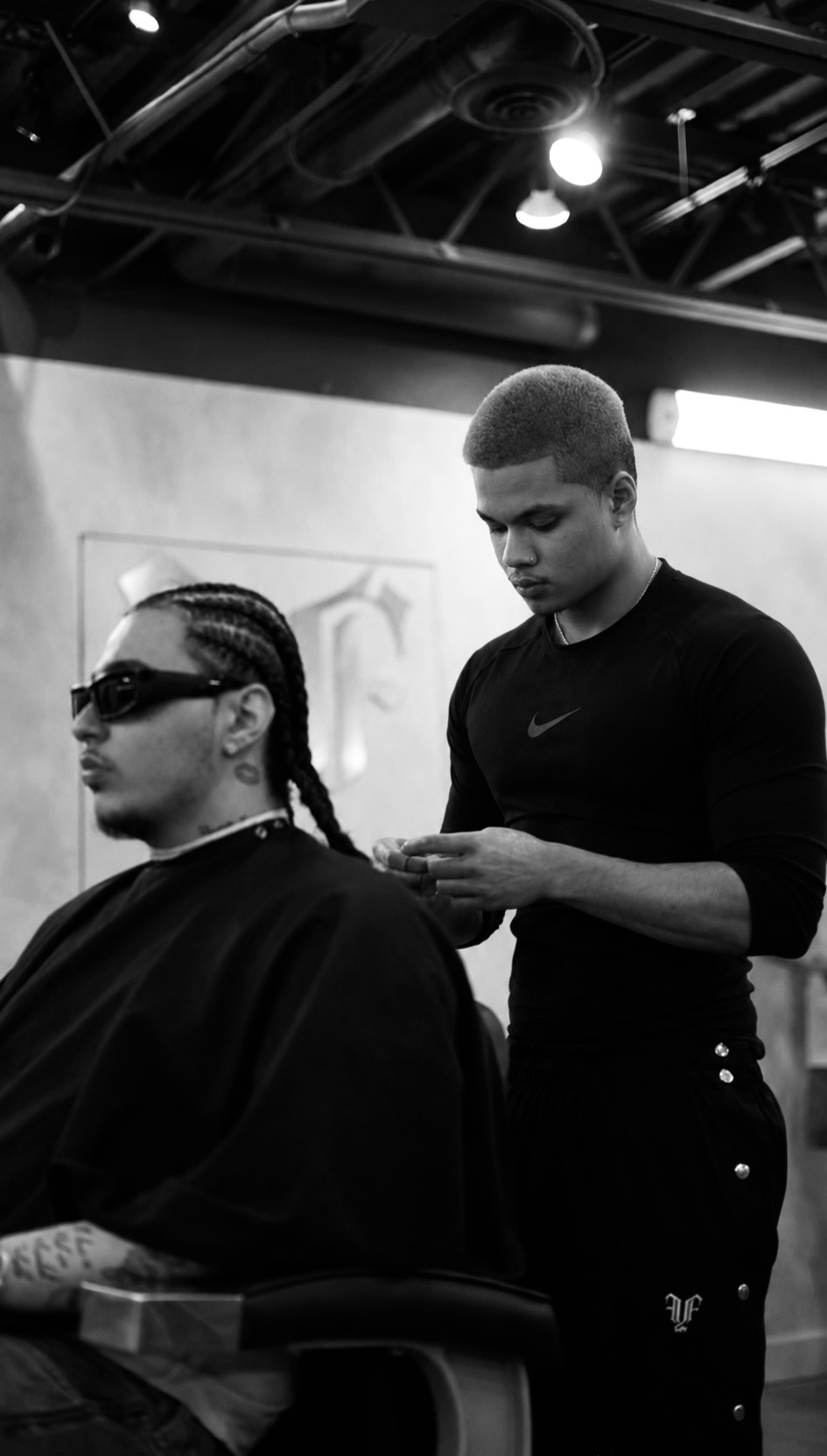 Founders Diego braiding R&B artist REALESTK in the studio at fyf North
