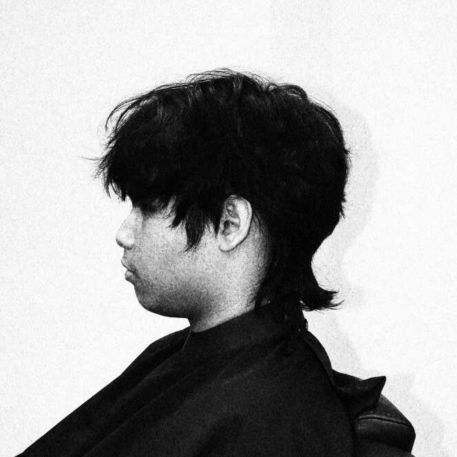 Dark textured mullet cut by Marcus Dela Cruz