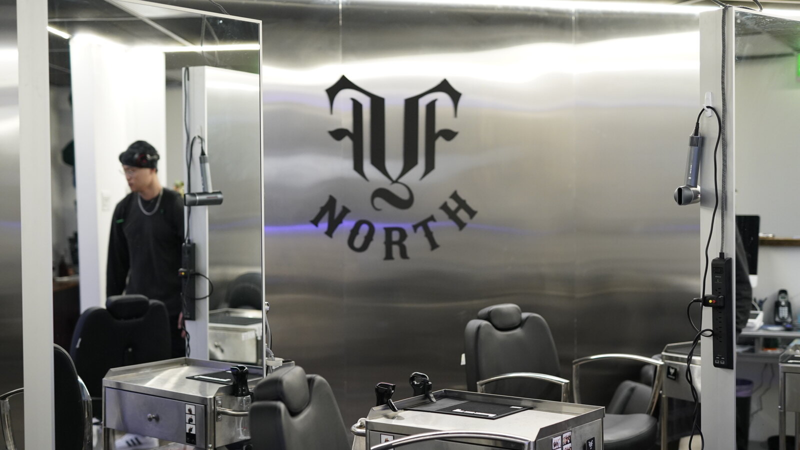 The stainless-steel barber stations inside fyf North
