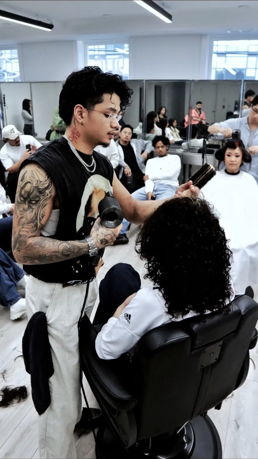 Stylist teaching a haircut demo at a fyf North education session