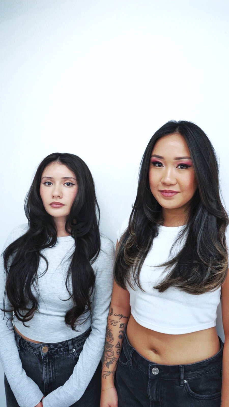 Two clients with long dark styled hair at fyf North
