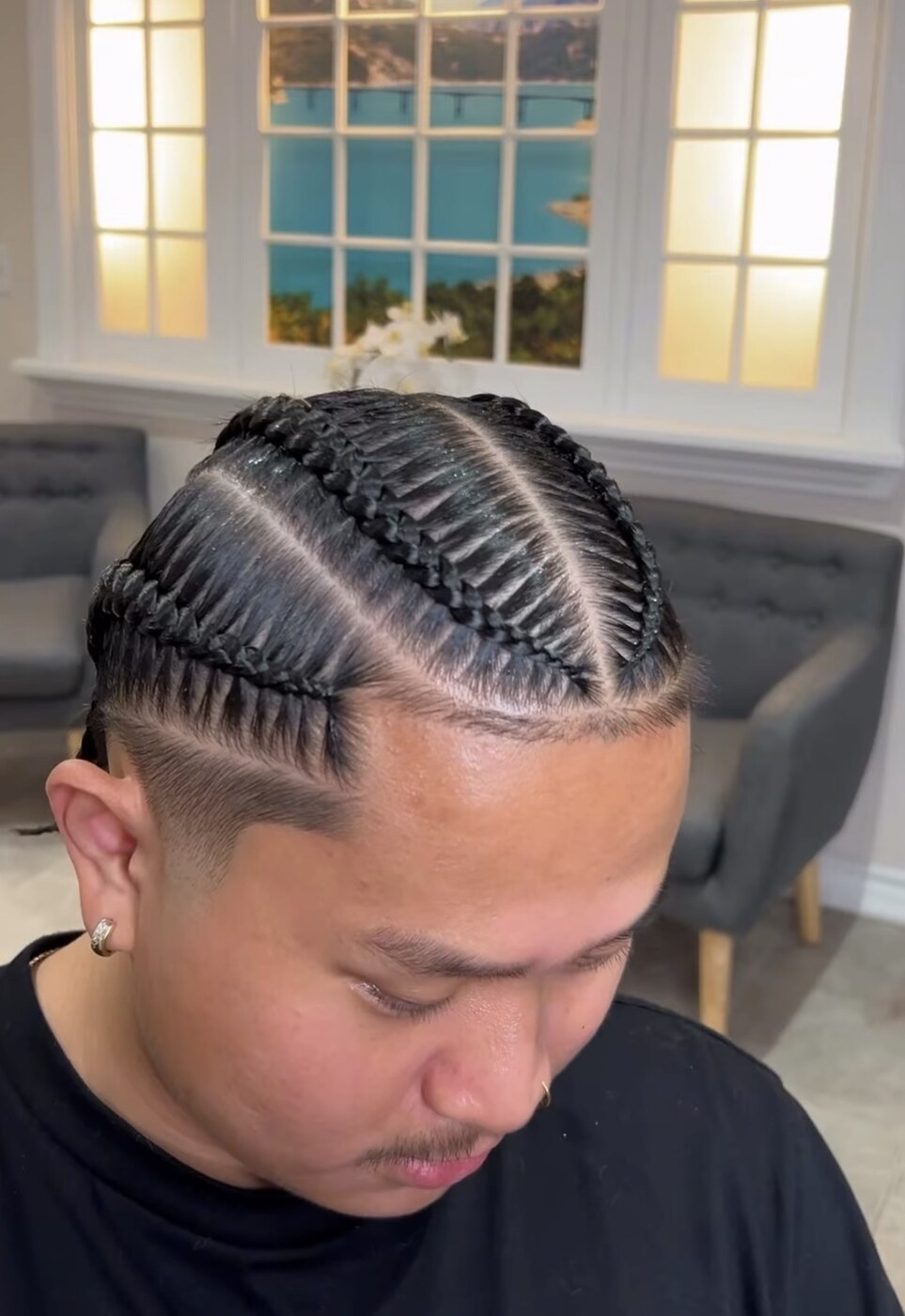 Cornrows braided into a faded haircut by Vanessa Tidalgo