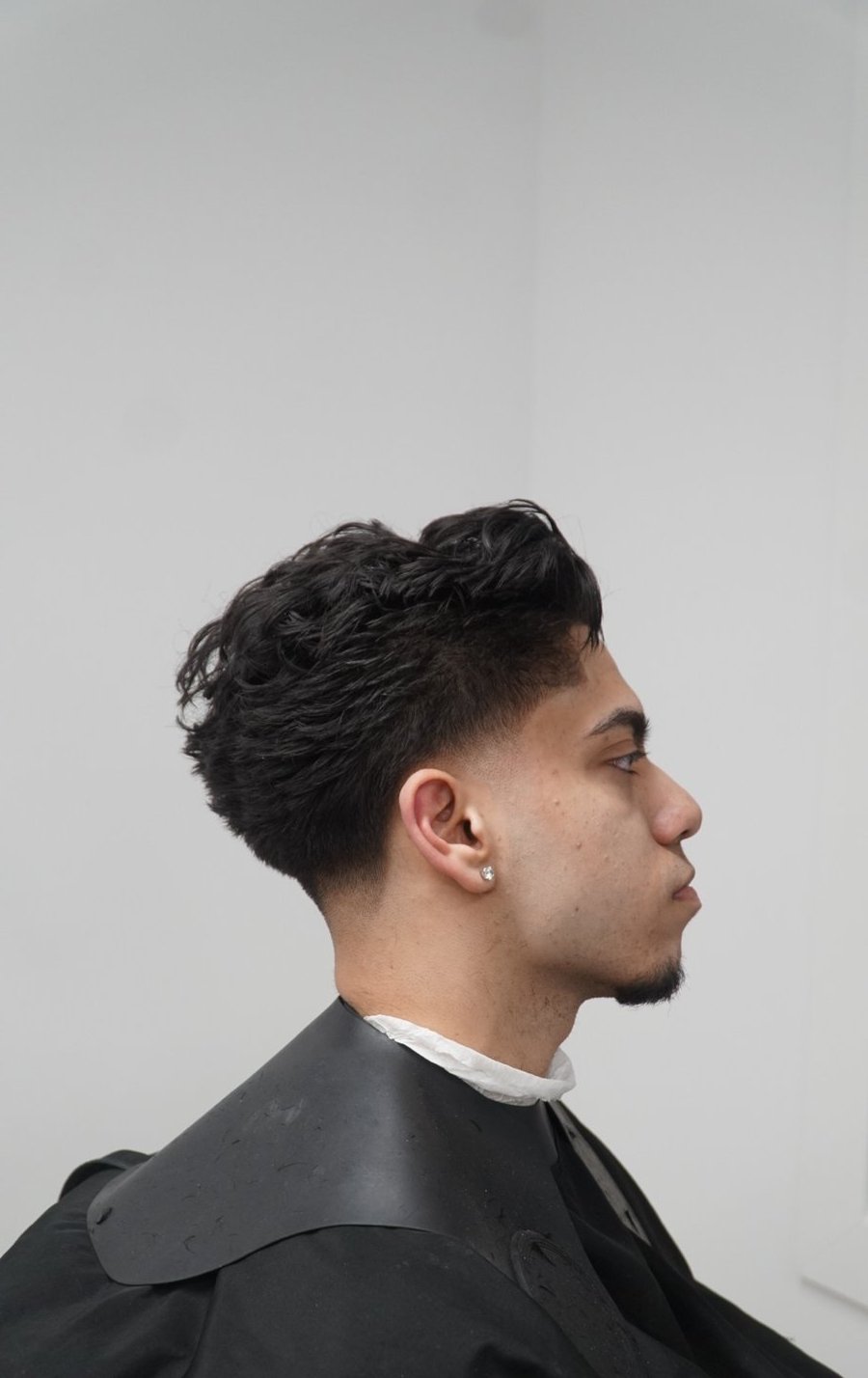 Client with a fresh cut in the studio at fyf North
