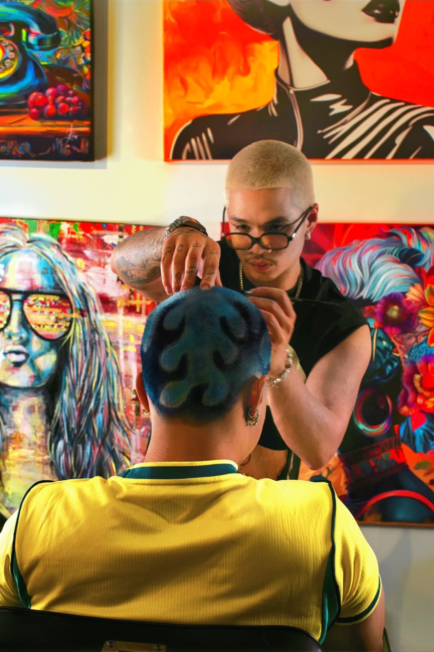 Iceman flames design carved and coloured into blue hair for a premiere hair showcase in Toronto