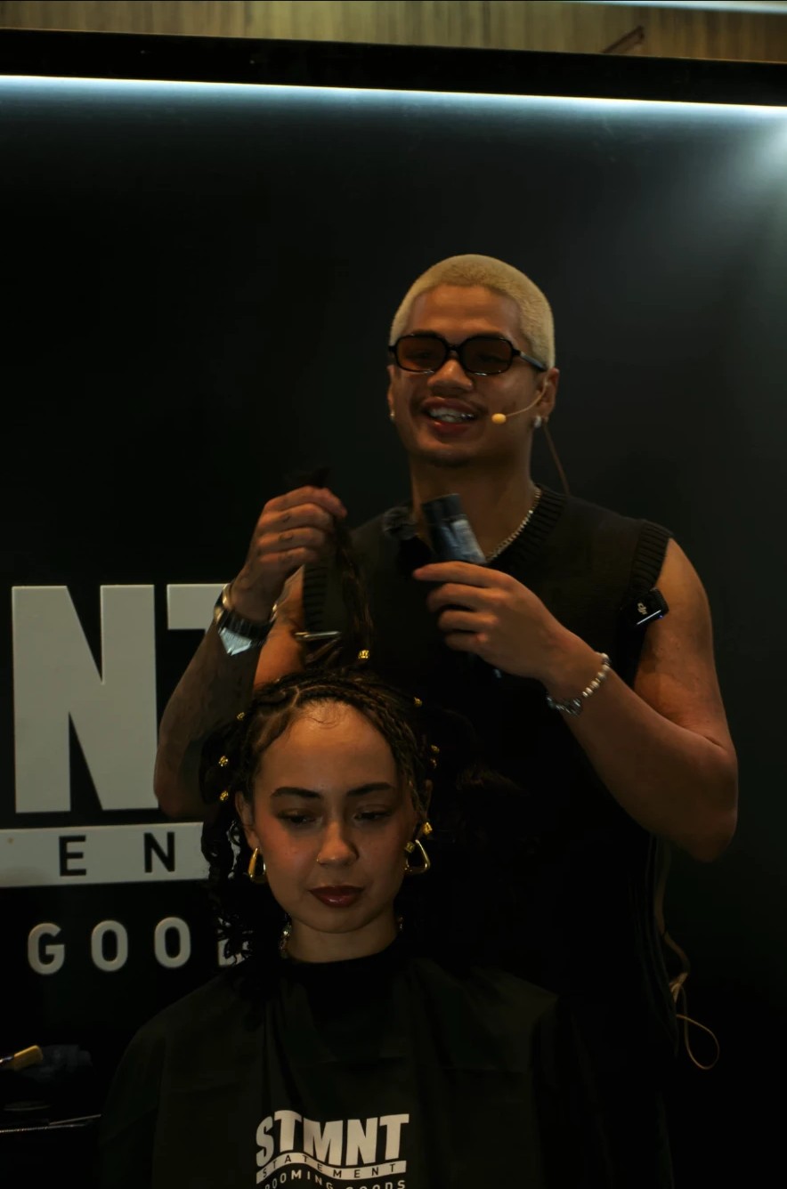 Live barbering demo on stage at a fyf North event