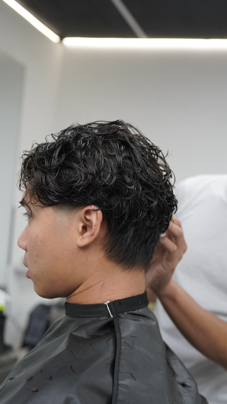 Wet textured mullet haircut in progress by AJ Thong