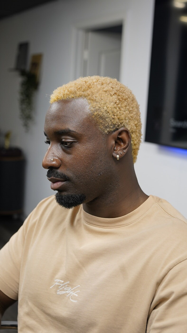 Bleached blonde tapered cut by AJ Thong